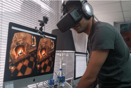 Student experimenting with virtual reality design and coding.